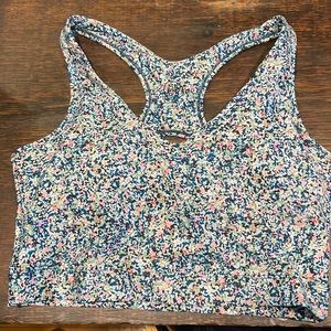 NWT work out top with FUN floral pattern and keyhole back! Great support!